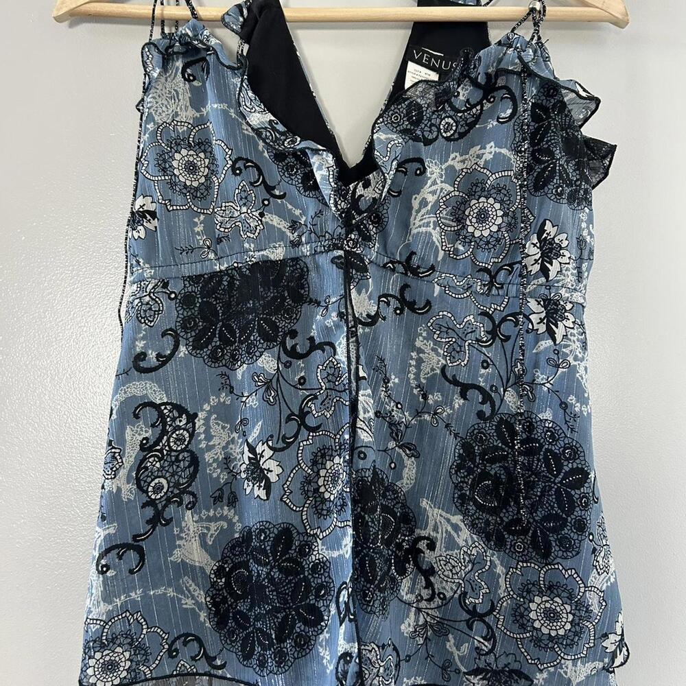 Venus blue floral blouse with black lace trim and bow detail.